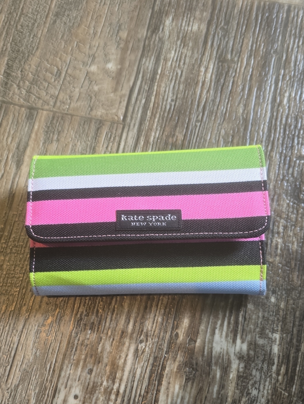 kate spade striped trifold wallet in lime green, hot pink, black, white, blue